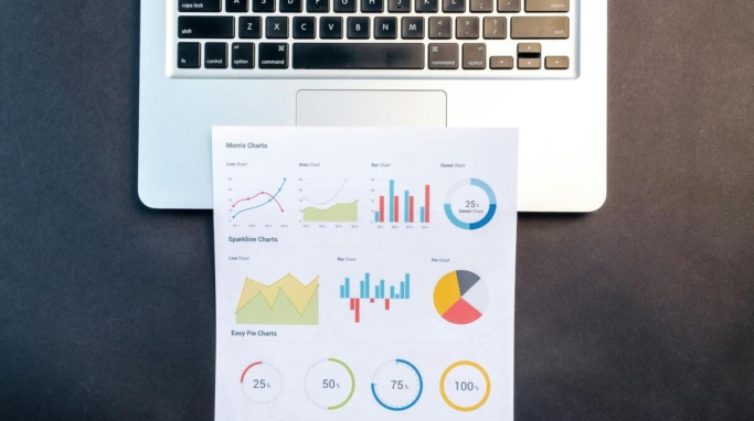 graphs on a sheet of paper by a laptop, Excel tips and tricks